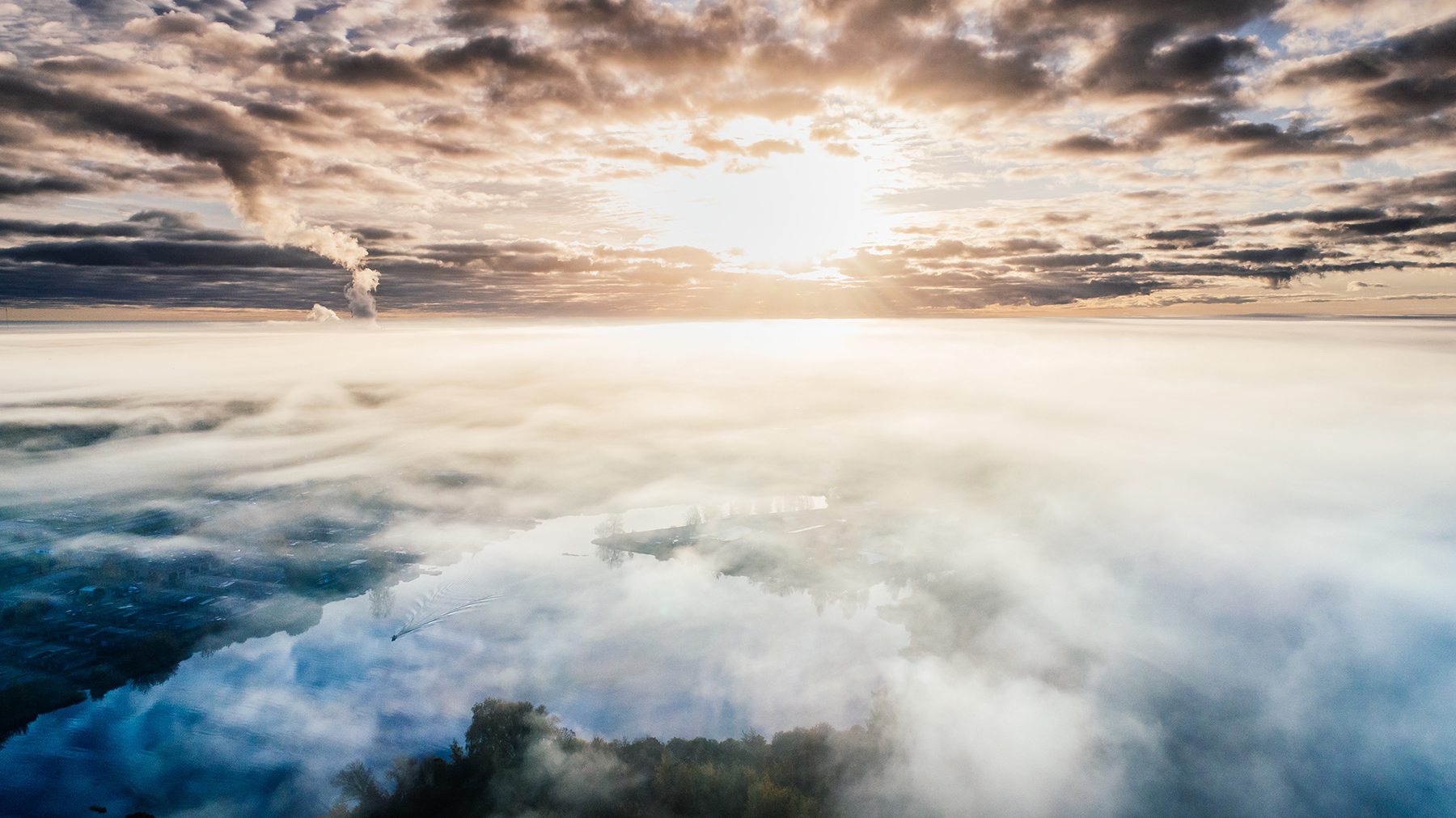 Sky with sunrise in the distance and clouds