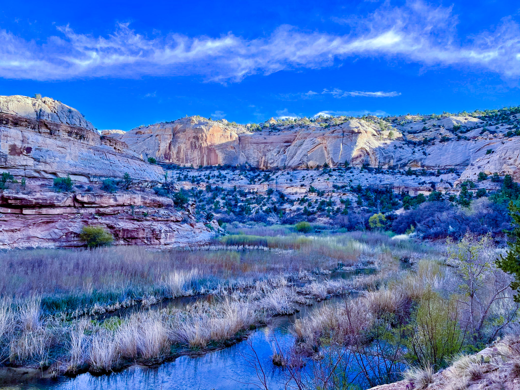 Bright blue sky overlooking canyon valley.
