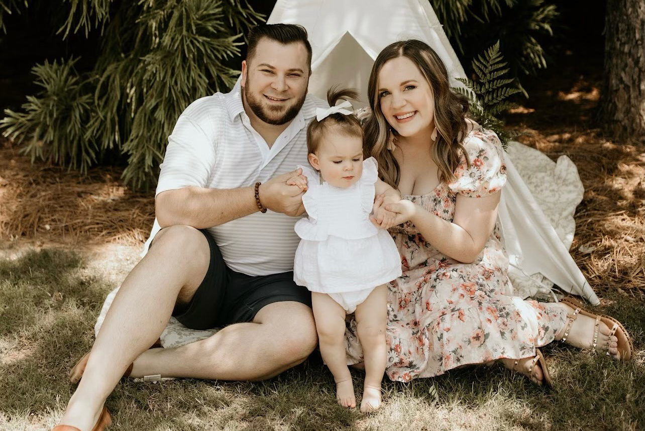 JP with his wife and baby daughter