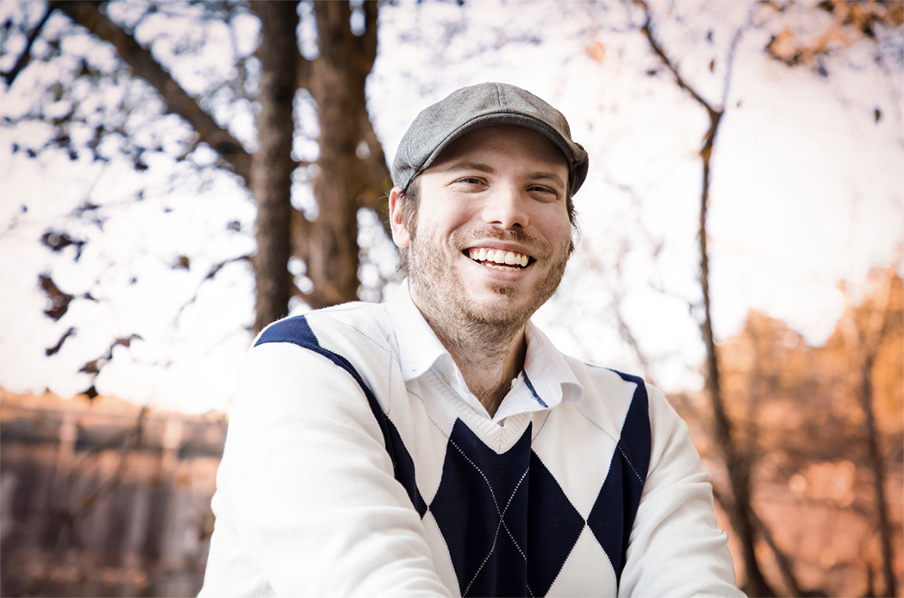 Photo of Steven Welch posing against a wooded background