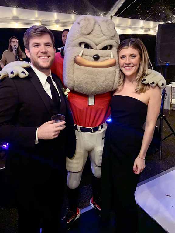 Will and his fiancee, Grace pose with UGA's mascot.