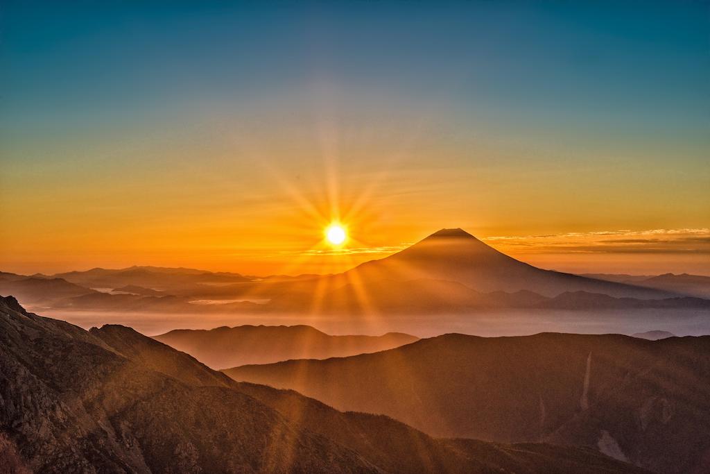Photo of a sunset at the top of Mount Fuji.